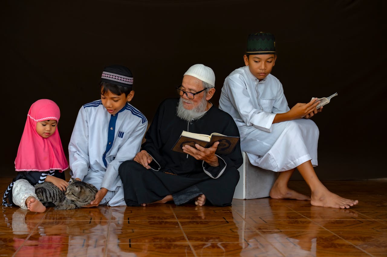 why-choose-us-01 A family of four reading indoors with a cat, highlighting cultural and familial bonds.